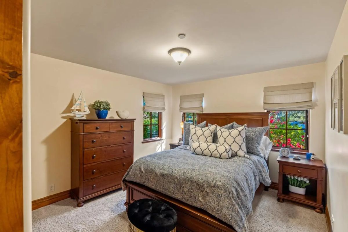 Four small windows bring in natural light and views of greenery outside.