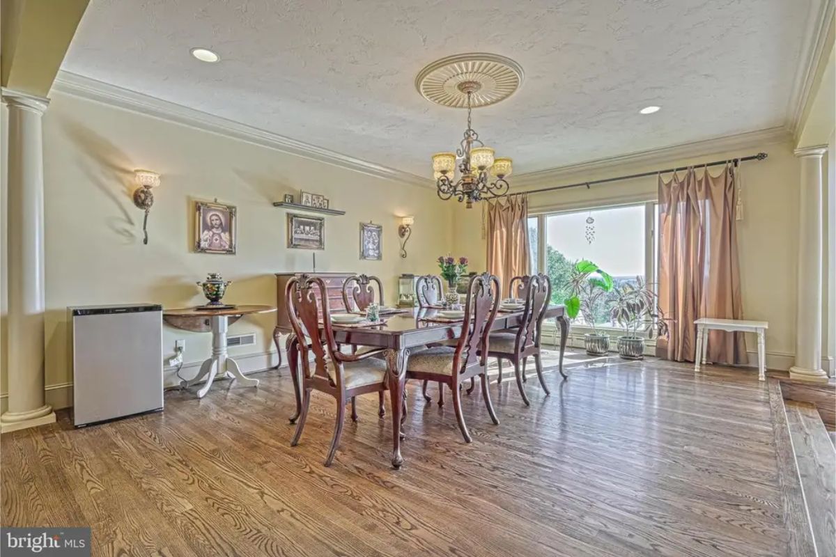 Wood flooring extends through the dining area.