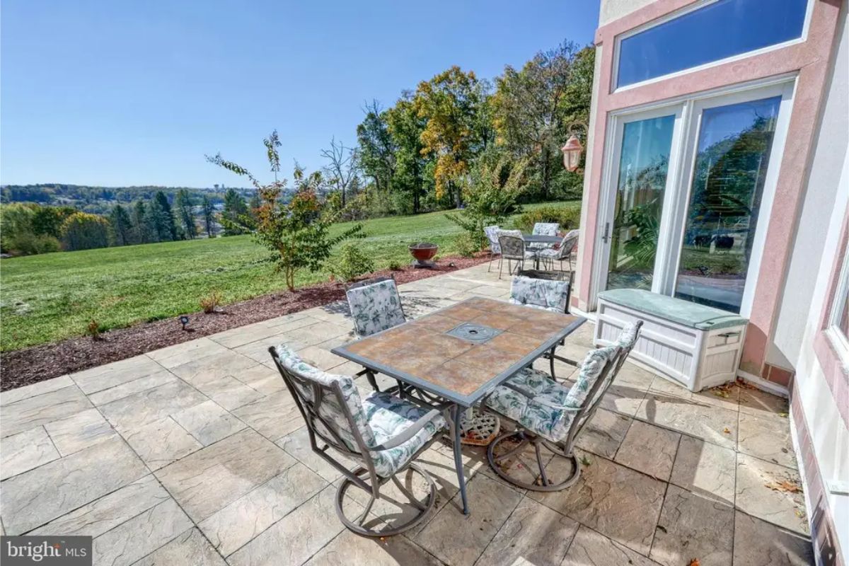 A paved patio provides space for outdoor seating.