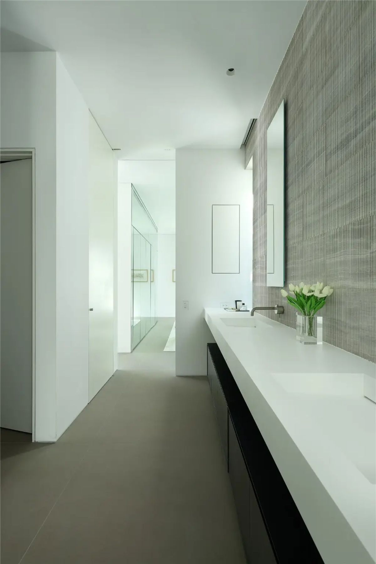 A spa-like bathroom with a double vanity, soft lighting, and elegant neutral tones. 