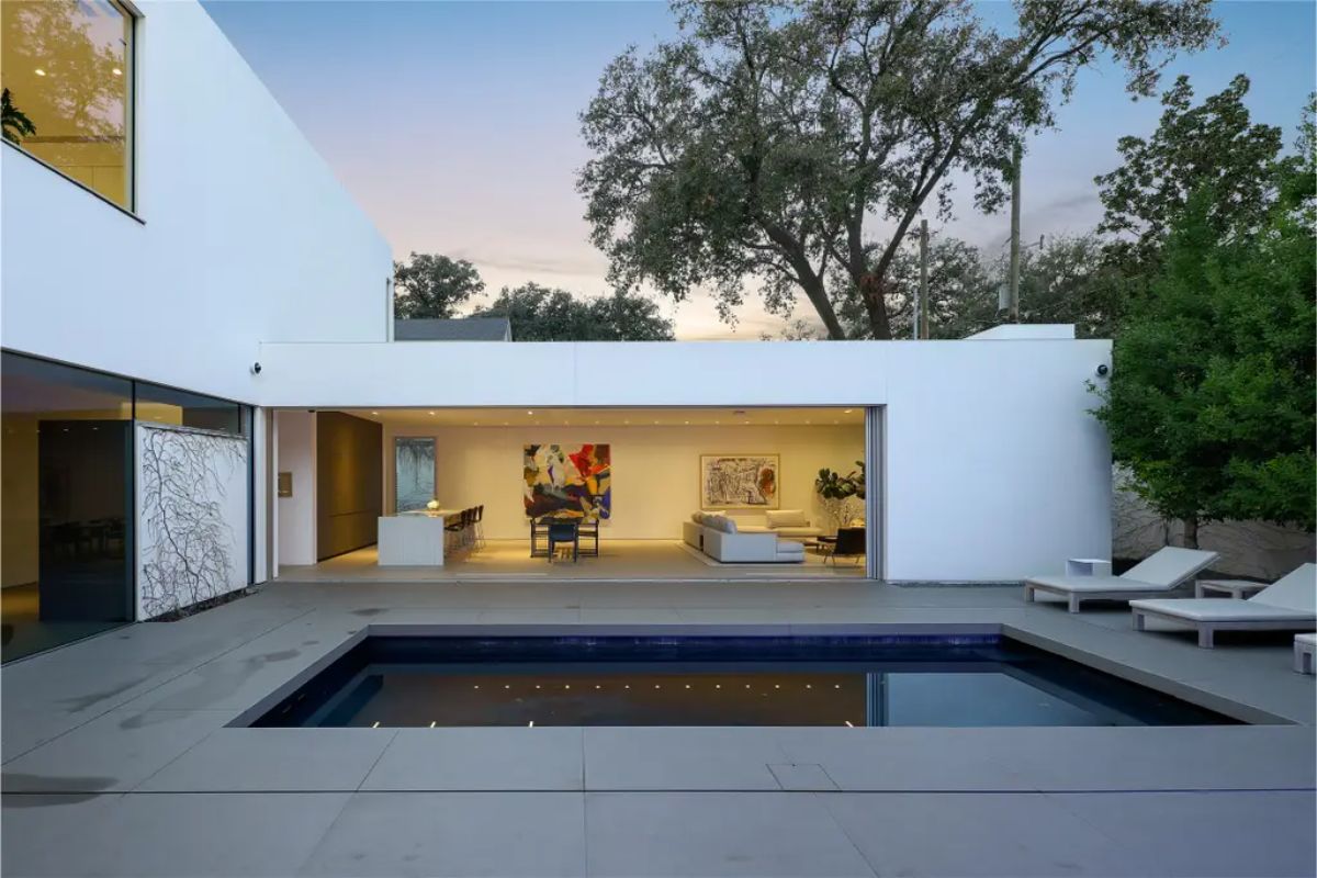 A symmetrical view of the pool courtyard, showcasing the seamless transition between indoor and outdoor living. 