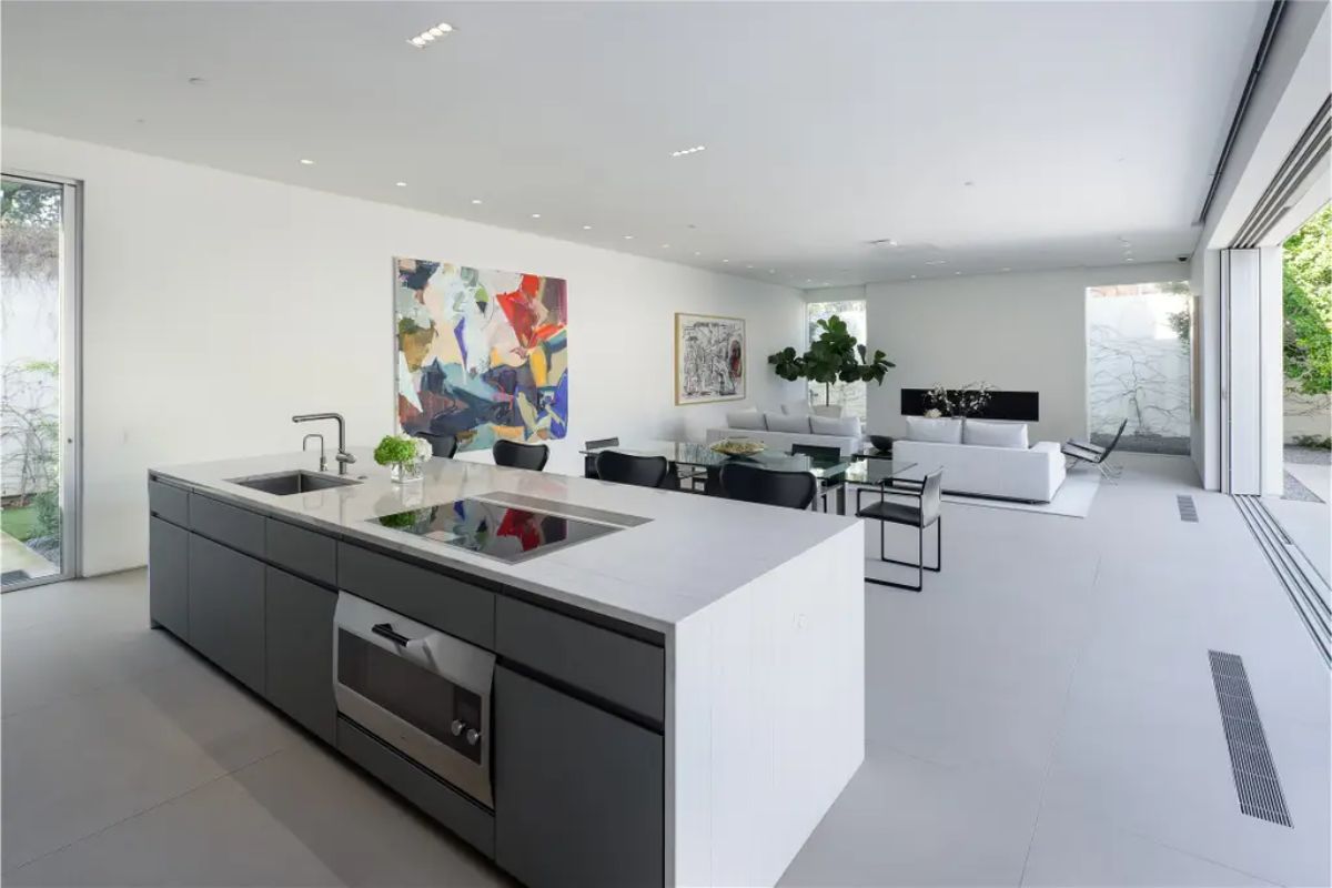 Ultra-modern kitchen with a minimalist island, sleek cabinetry, and an airy open floor plan. 