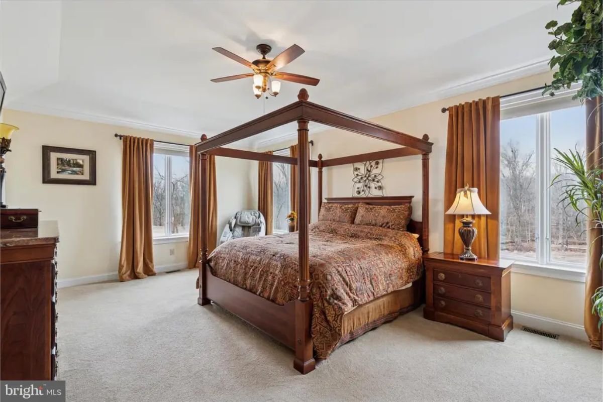 Large windows provide natural light and views of the surrounding landscape.