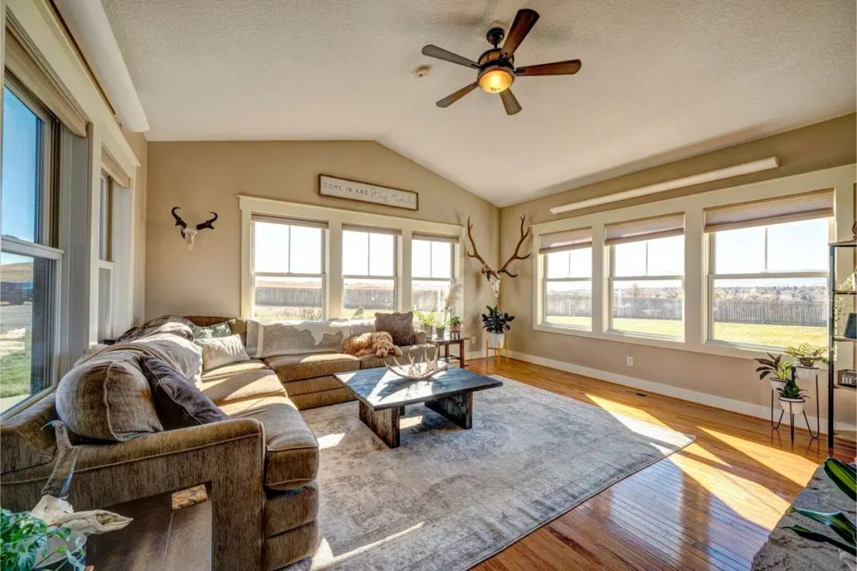 Large windows provide panoramic views of the surrounding landscape.