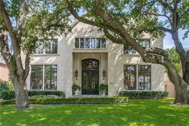 Stately Facade with Majestic Trees Framing the Entrance