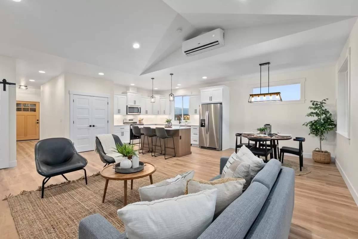 Spot the Seamless Blend of Kitchen and Living Areas with a Striking Island
