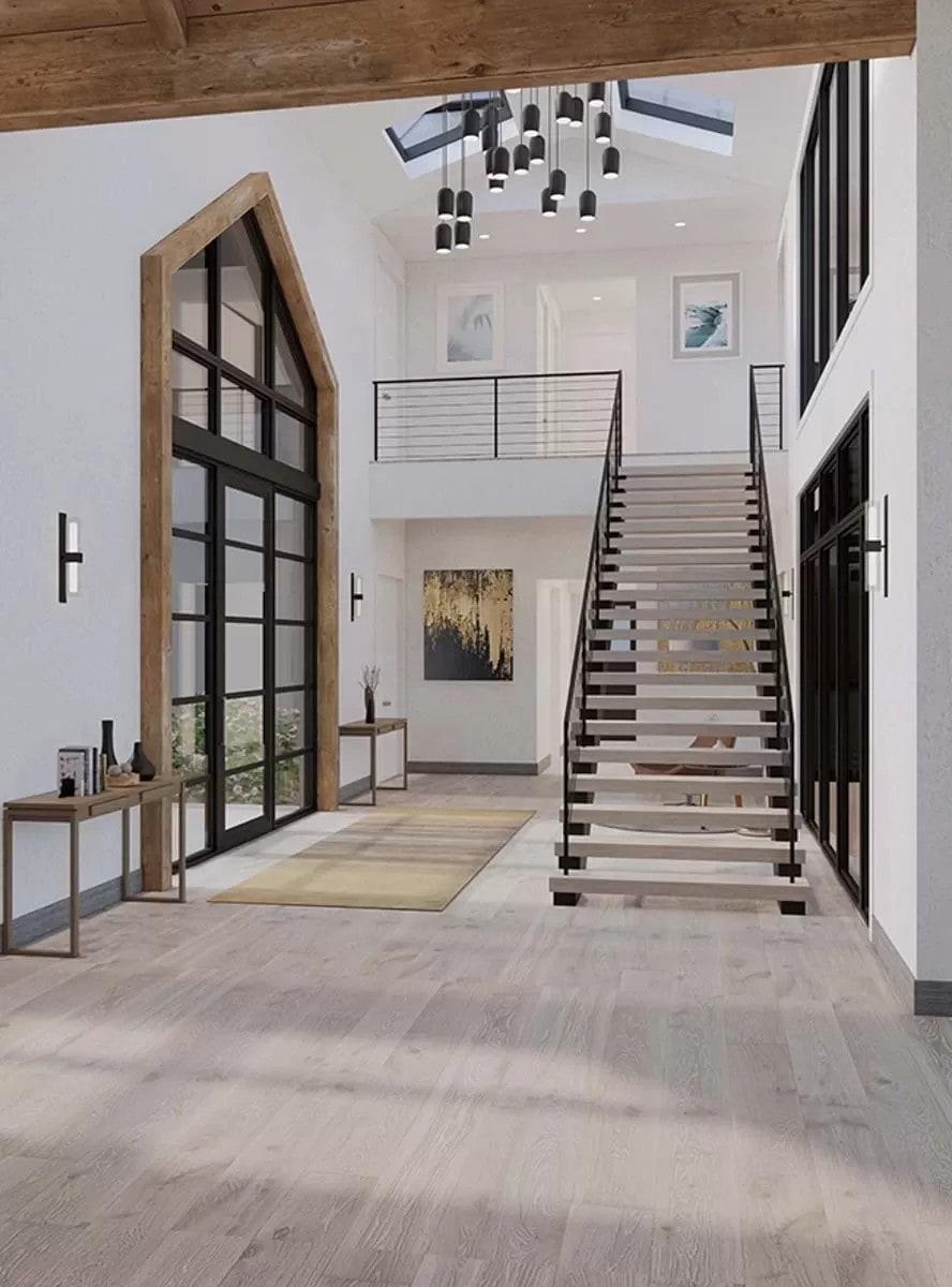 Breathtaking Entrance with Sky-High Ceilings and a Floating Staircase