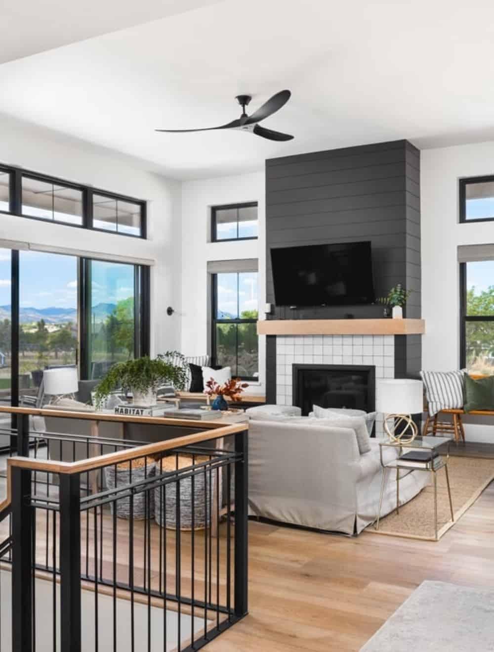 Contemporary Living Room with a Striking Black Fireplace