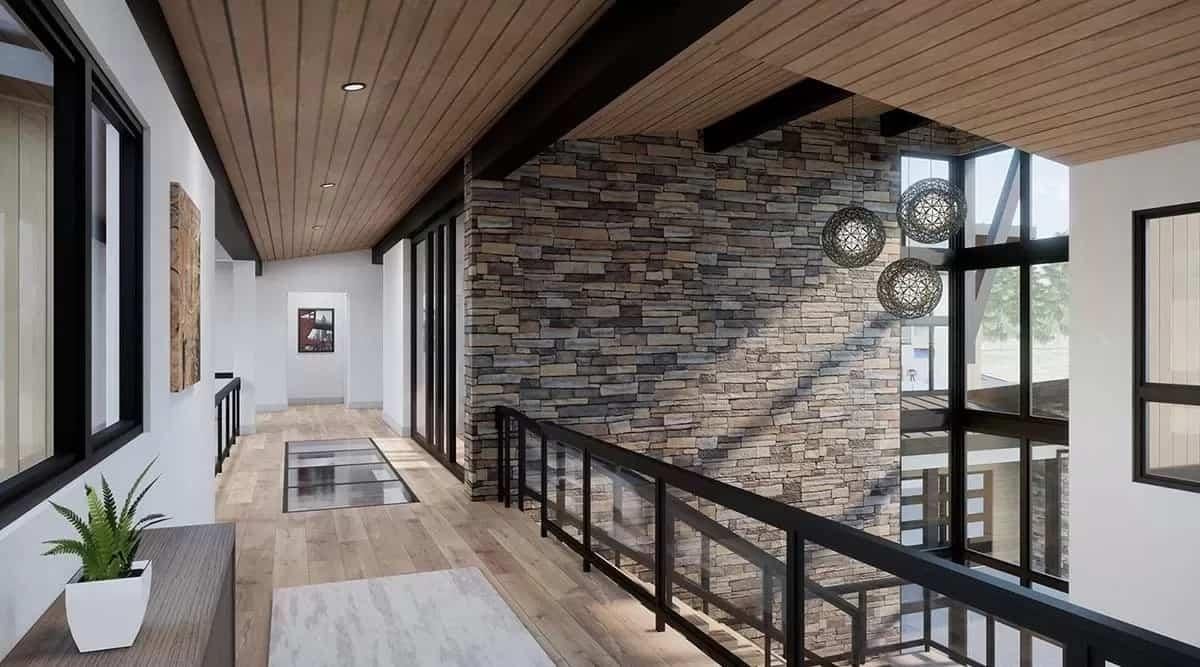 Check Out the Linear Pendant Lights Reflecting on the Stone Feature Wall