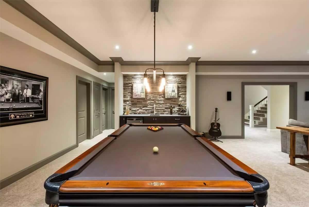 Wow, Check Out the Stone Accent Wall in This Inviting Game Room