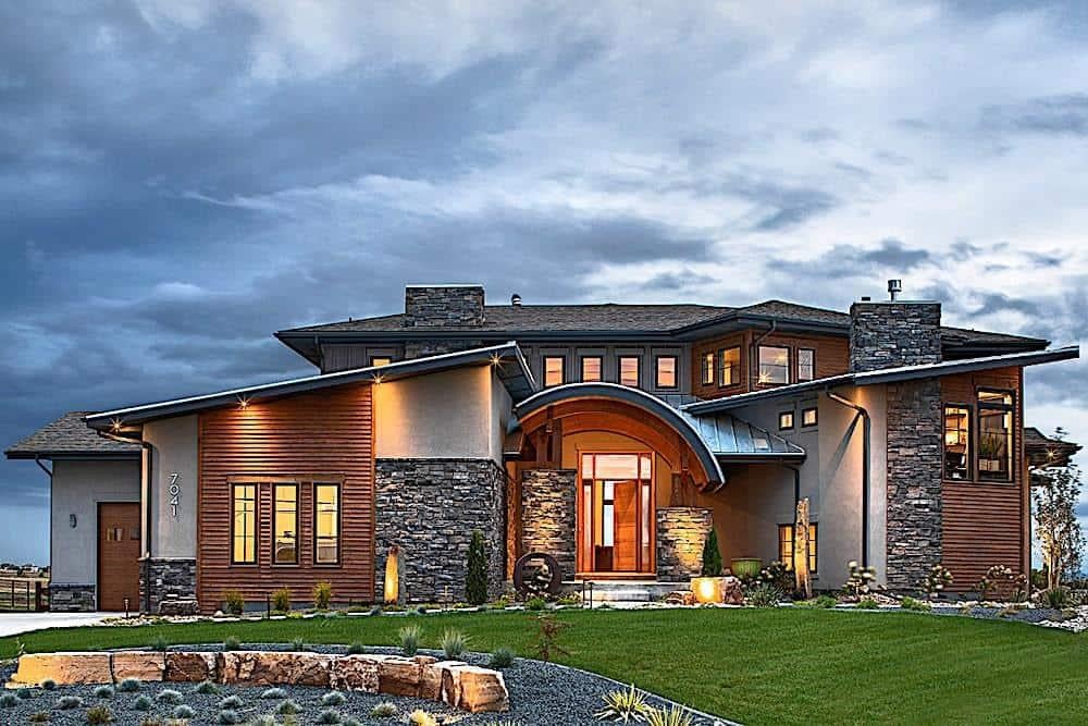 Modern Craftsman Exterior with Striking Stone Accents and Curved Roofline