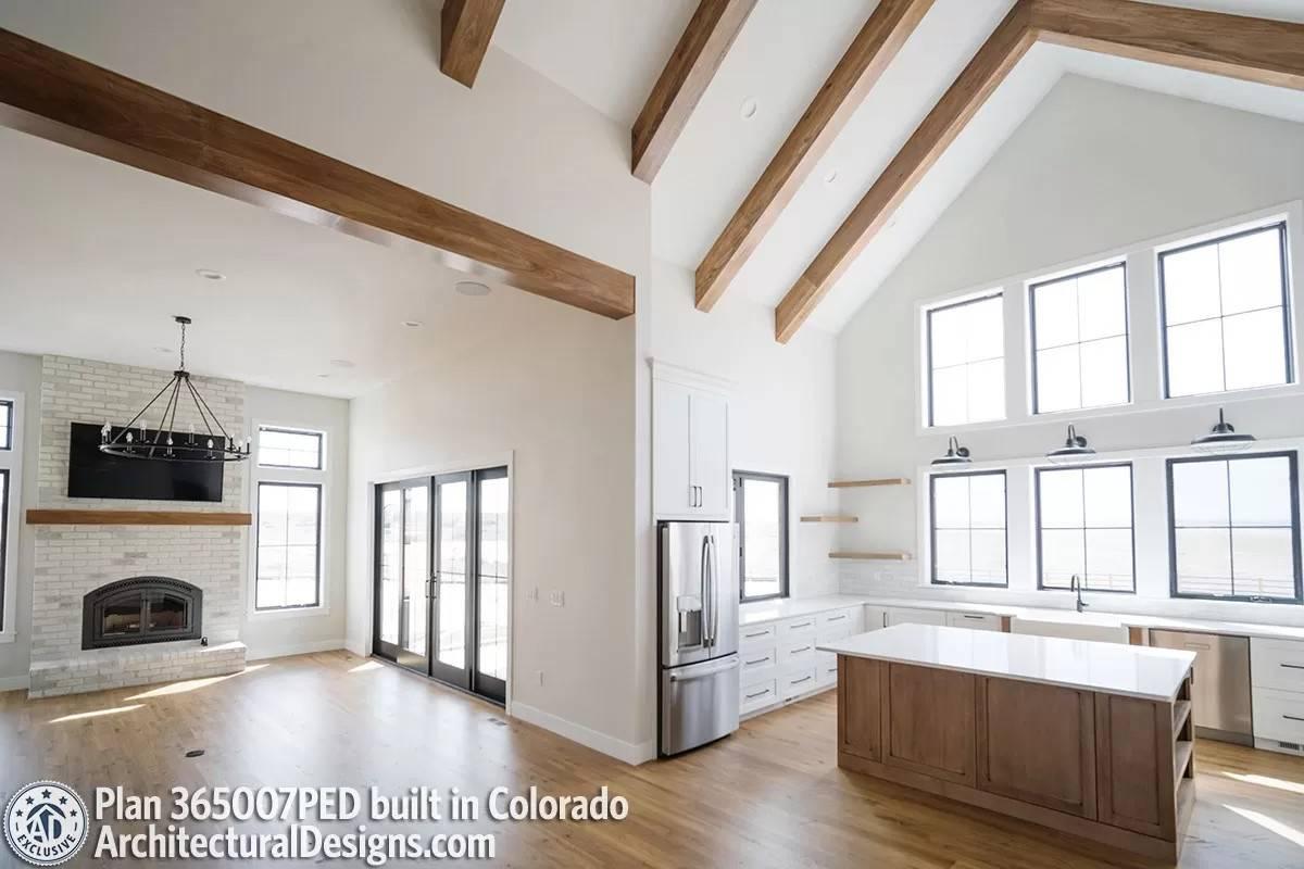 Vaulted Ceilings and Exposed Beams Create Drama in This Open Living Space