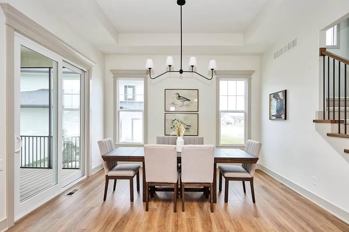 Notice the Modern Chandelier Elevating This Craftsman Dining Area