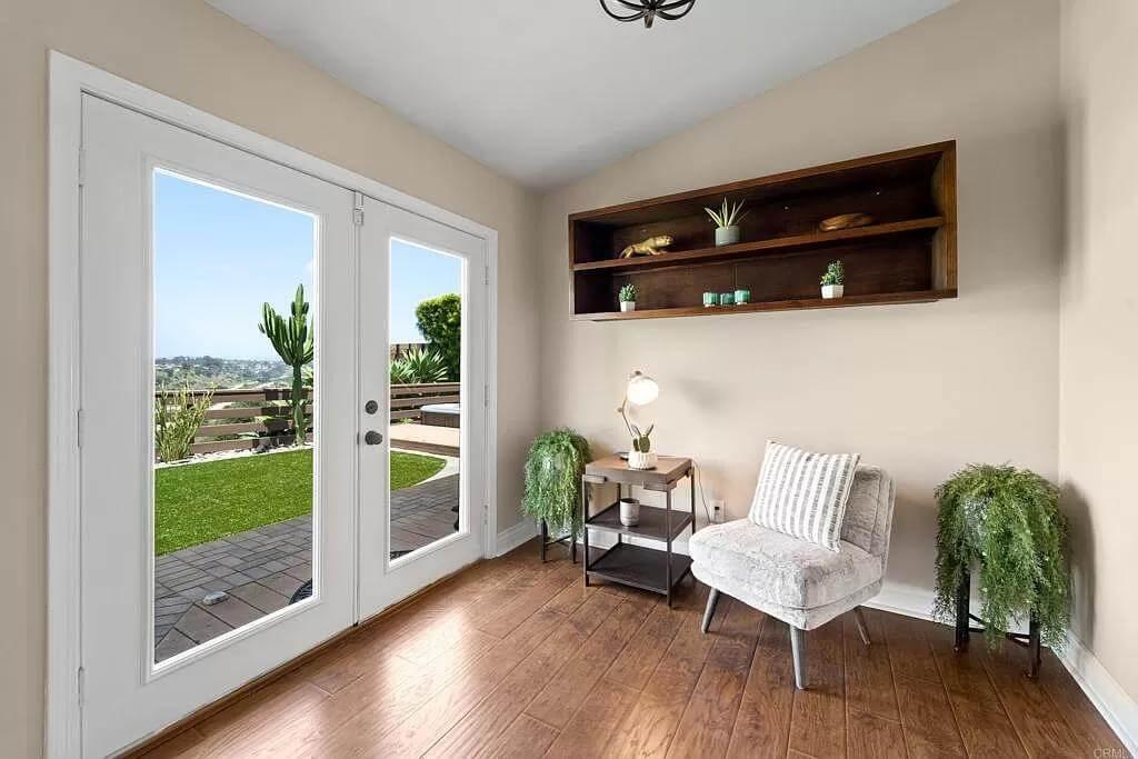 A Cozy Alcove with Stunning Double French Doors Leading Outside