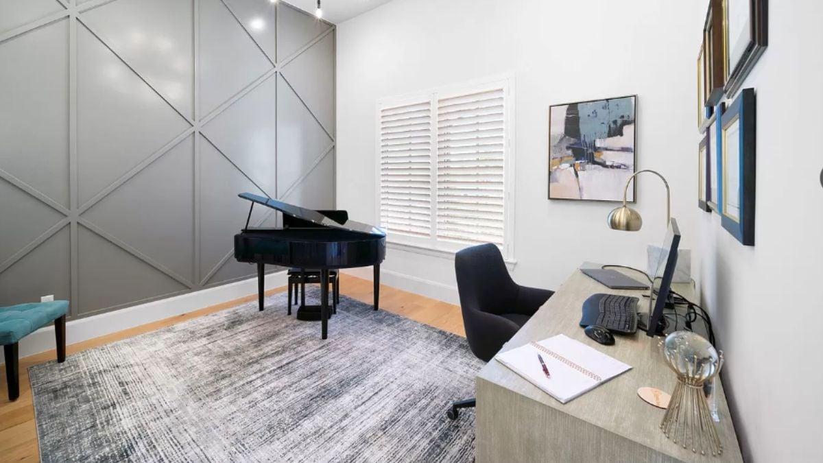 Sophisticated Music Room with Geometric Accent Wall and Grand Piano