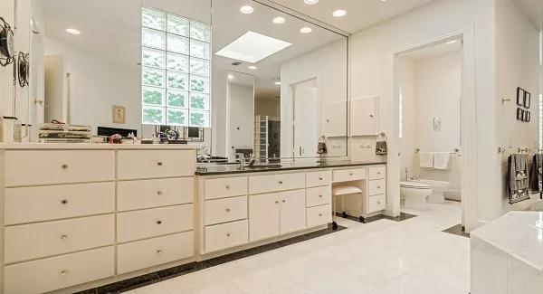 Check Out the Spacious Vanity Area in This Bright Bathroom
