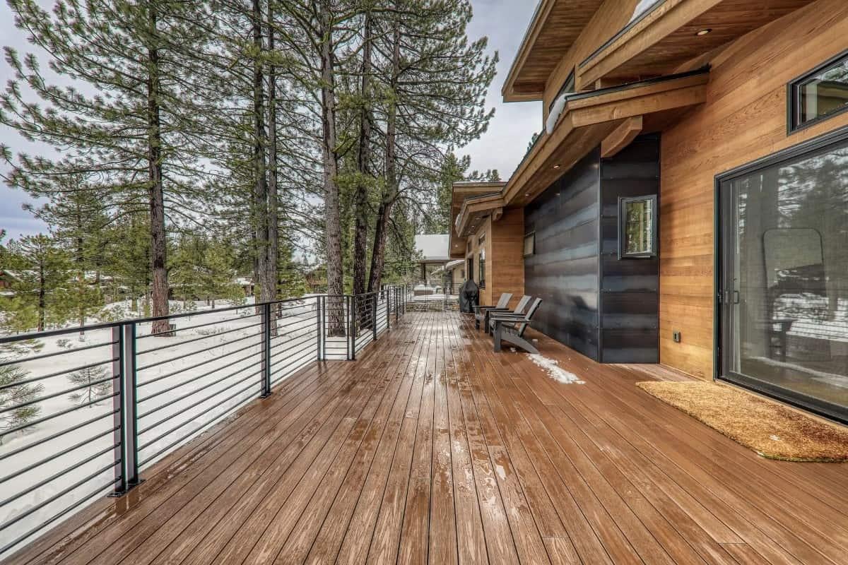 Admire the Expansive Deck with Its Sleek Metal Railing