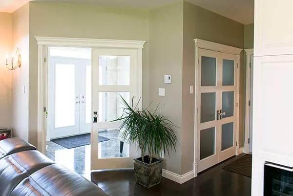Minimalist Entryway with Frosted Glass Doors and Subtle Decor