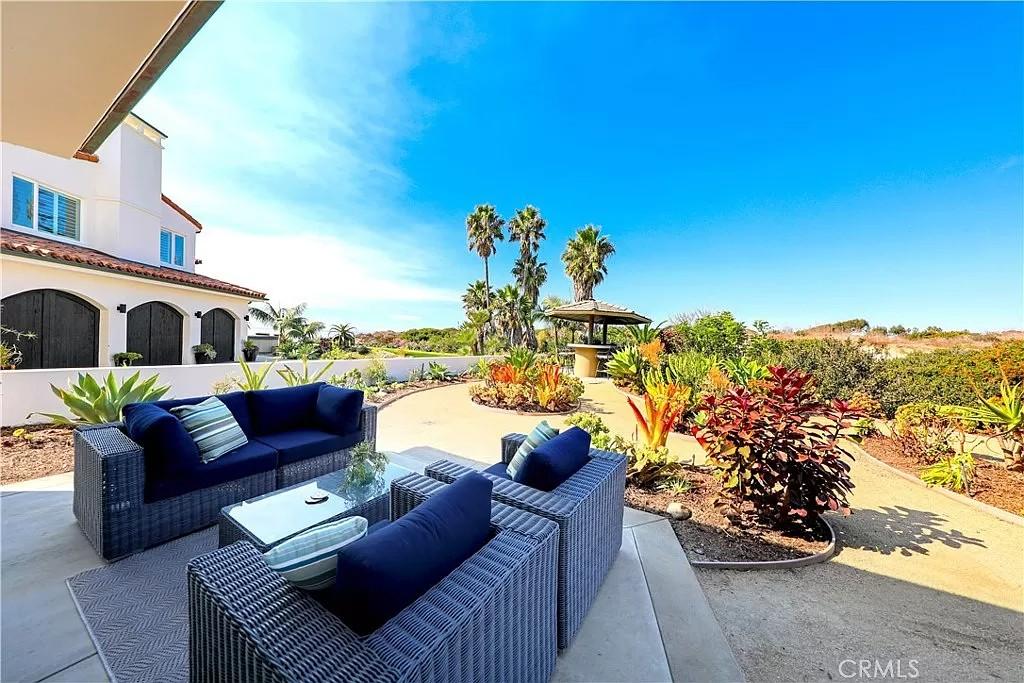 Enjoy Outdoor Living with Lush Gardens and Comfortable Seating