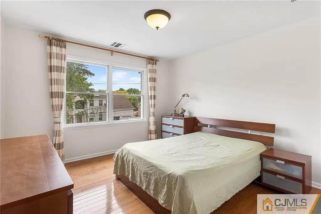 Simple Bedroom with a View Through Double Windows