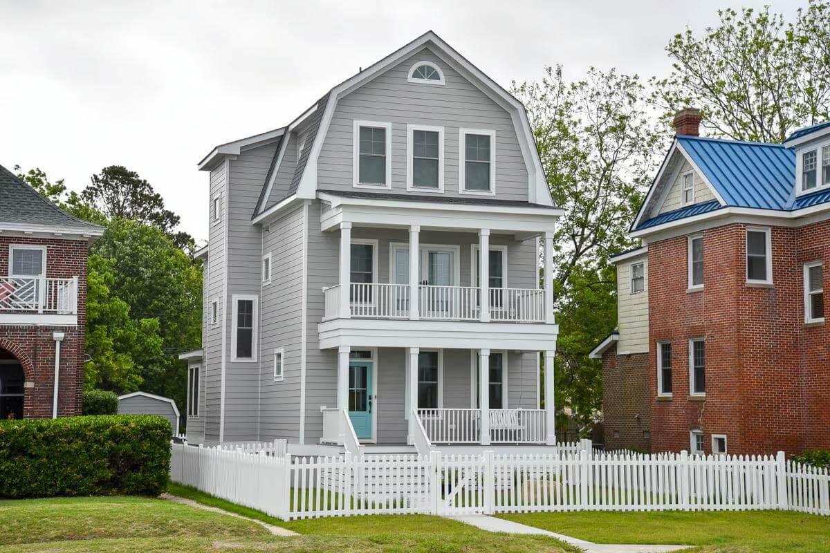 Classic Gambrel Roof Home with Charming Double Porches