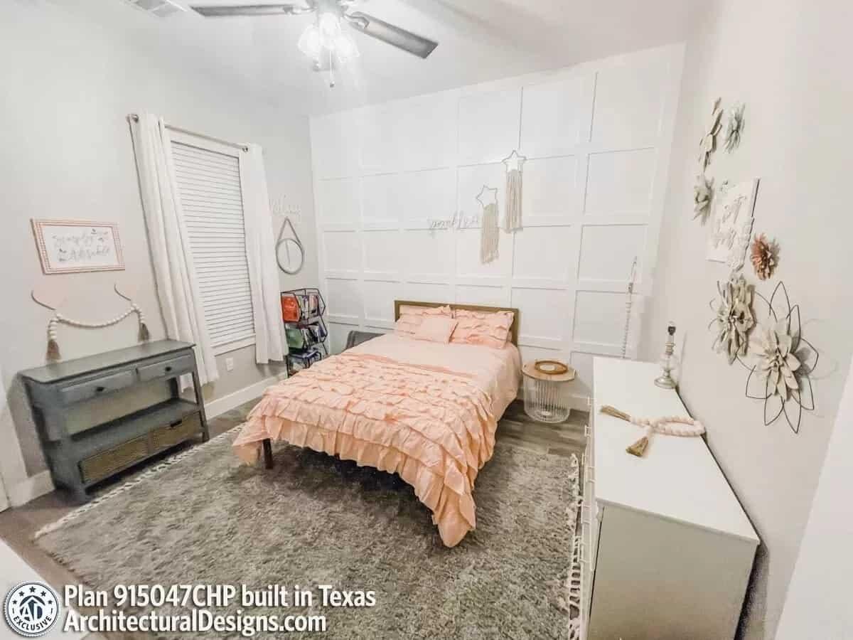 Charming Bedroom with a Unique Accent Wall and Soft Textures