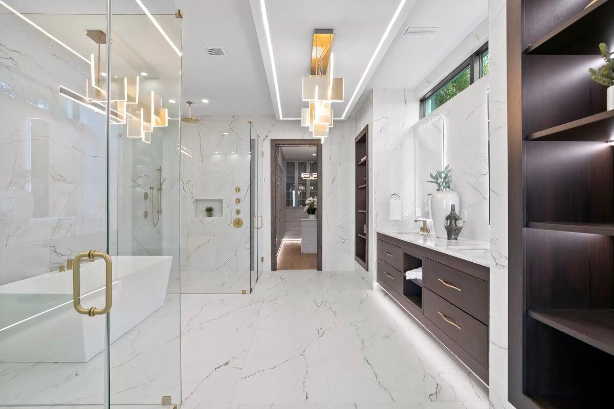 Luxurious Bathroom with Marble Detailing and LED Lighting Accents