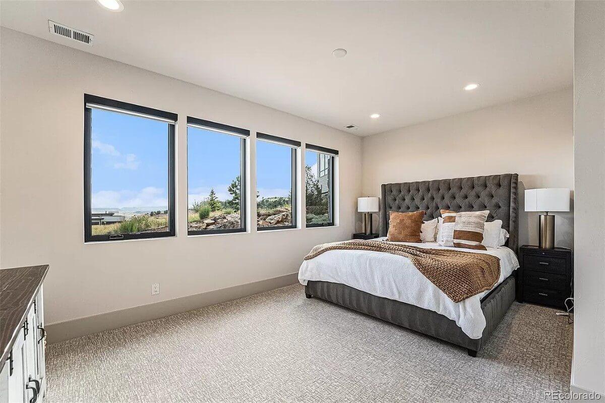 Check Out the Plush Headboard in This Sunlit Bedroom