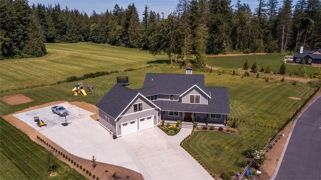 Expansive Countryside Setting with Craftsman Features and Play Area