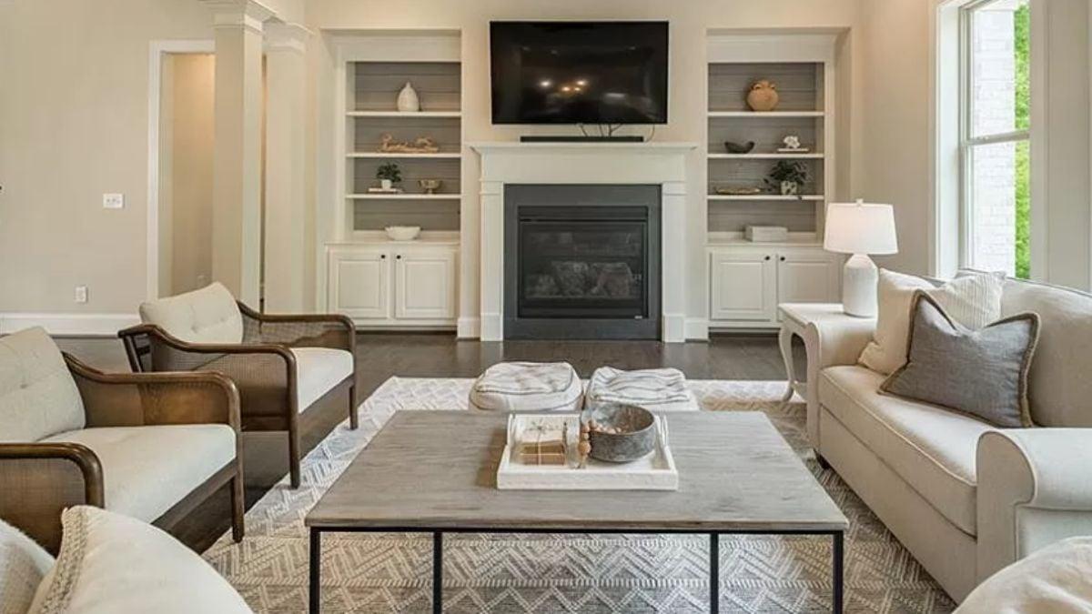 Sophisticated Living Room with a Central Fireplace and Built-In Shelving
