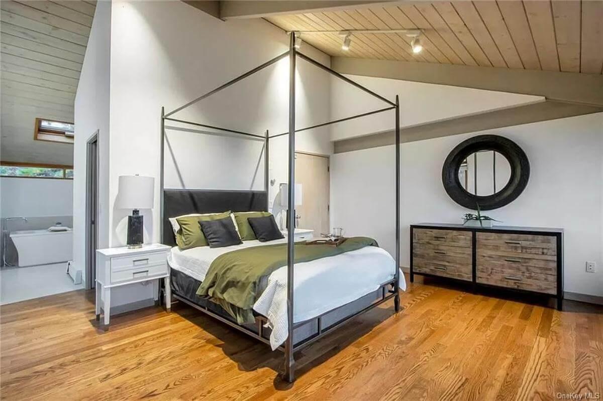 Explore This Minimalist Bedroom with a Striking Canopy Bed