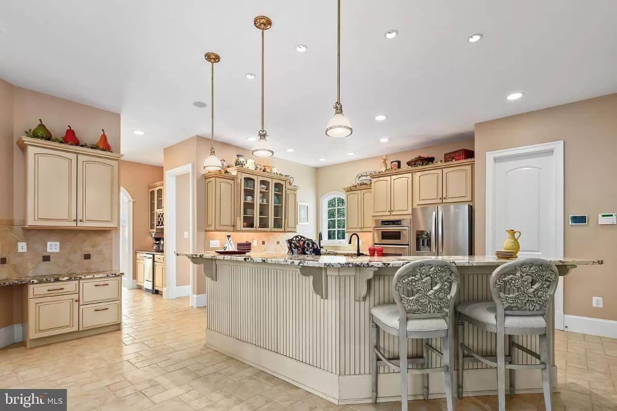 Check Out the Ornate Detailing on the Bar Stools in This Traditional Kitchen