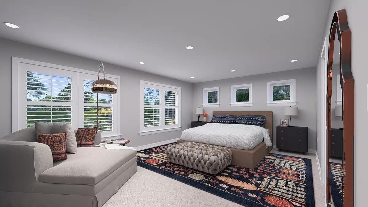 Spacious Bedroom with Stylish Ottoman and Plush Seating Area