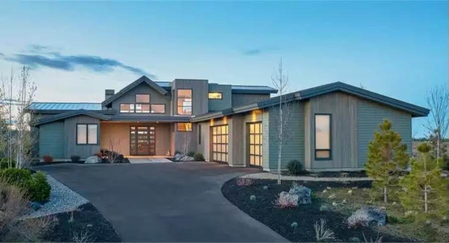 Modern Craftsman Exterior Highlighted by Glass Garage Doors