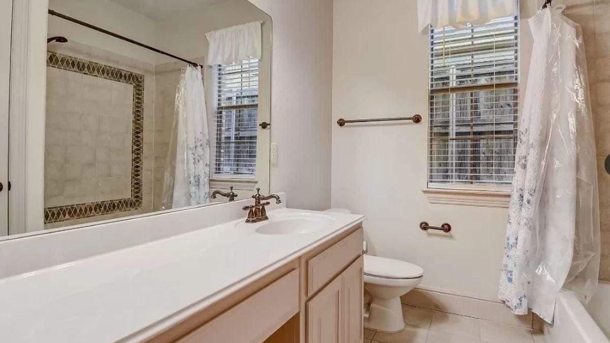 Take a Look at the Detailed Tiling in This Classic Bathroom