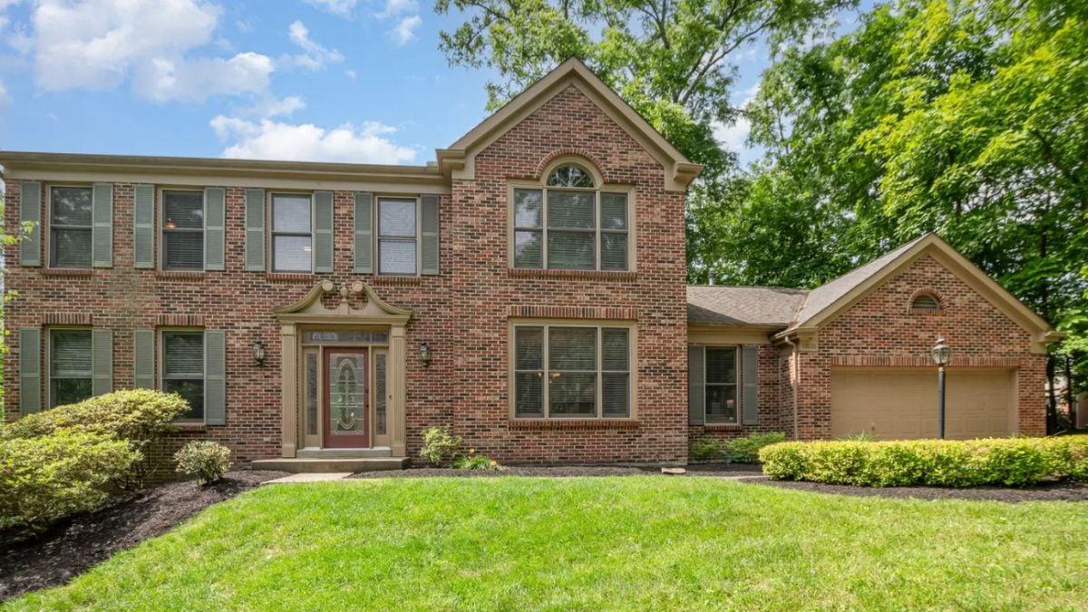 Classic Brick Facade with Symmetrical Windows and A Timeless Appeal