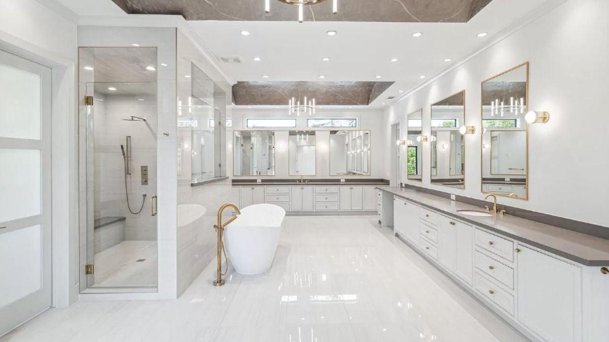 Admire the Freestanding Tub and Double Vanities in This Luxurious Bathroom
