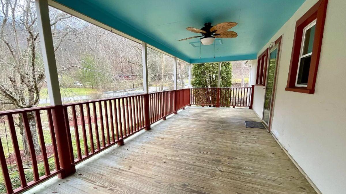 Check Out the Playful Sky Blue Ceiling on This Wraparound Porch