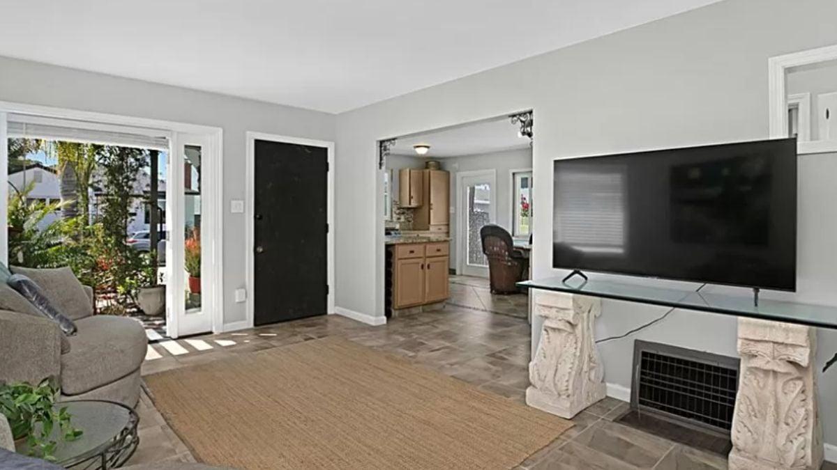 Spot the Quirky TV Table with Classic Pedestals in this Living Room