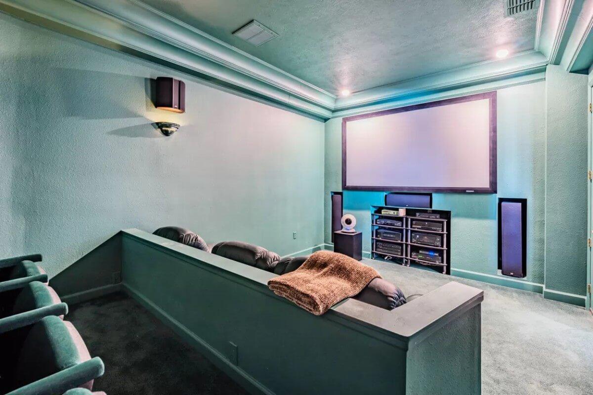 Step into This Expansive Home Theater with Elevated Seating
