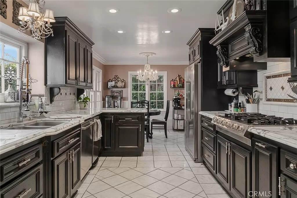 Elegant Kitchen with Ornate Cabinetry and Marble Countertops