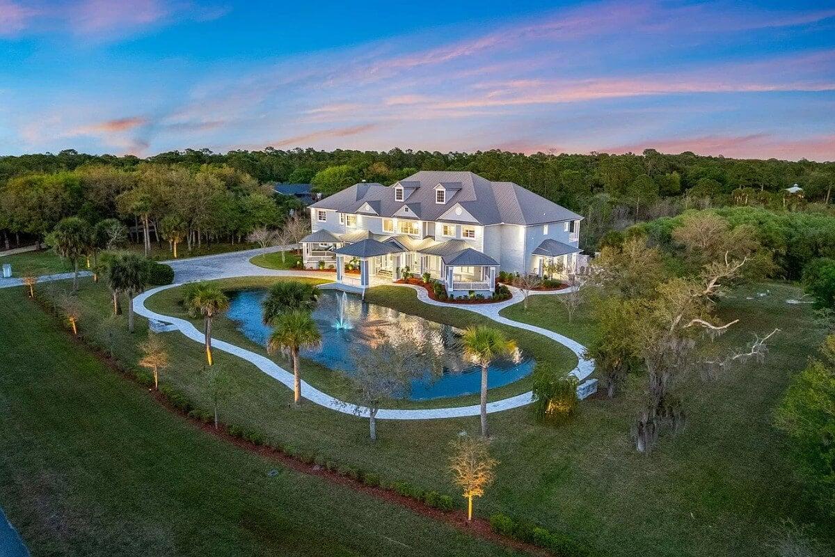 Stunning Estate with Reflective Water Feature and Lush Landscaping