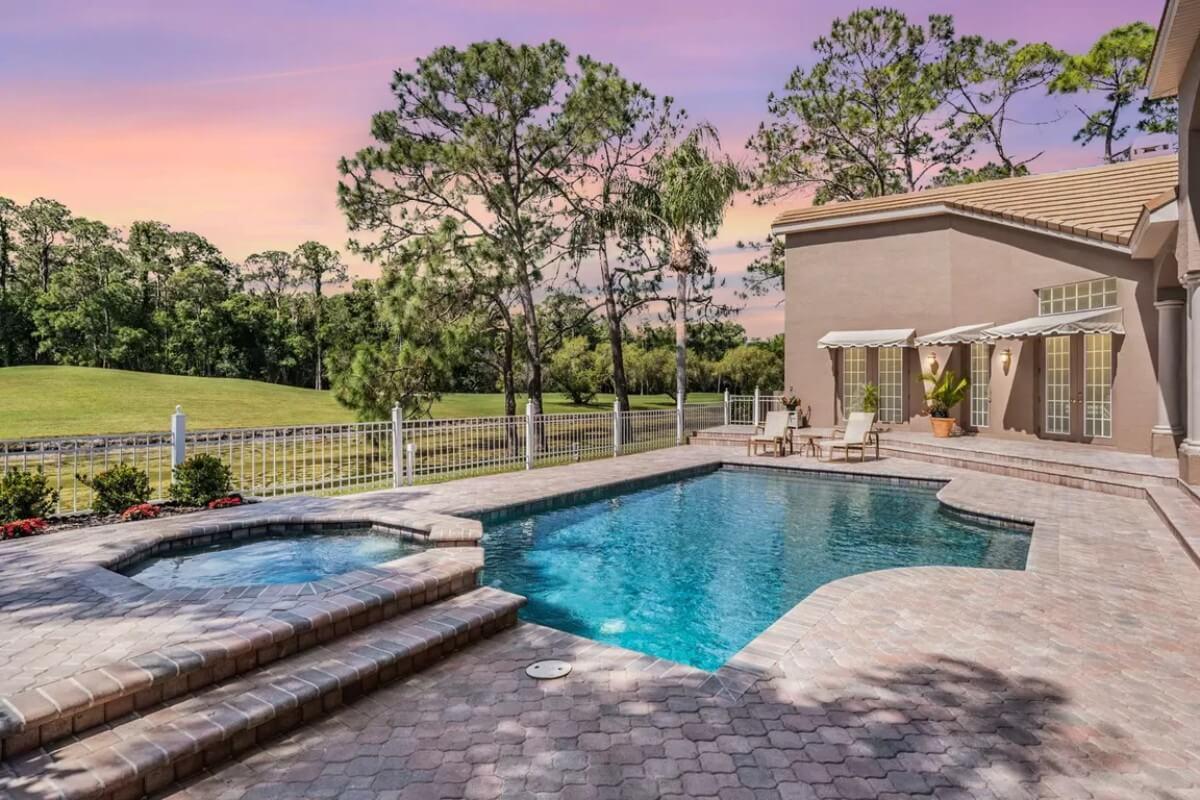 Enjoy the Sunset by This Gorgeous Pool with Built-In Spa