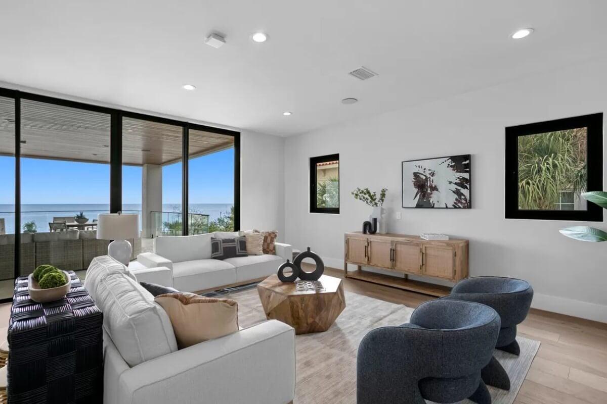 Chic Living Room with Geometric Coffee Table and Ocean Views