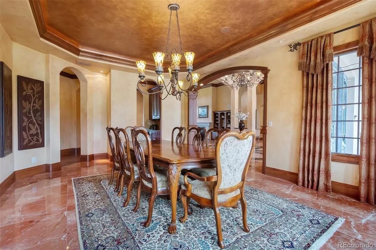 Wow, Look at That Grandeur: Dining Room with Marble Floors and Intricate Ceiling