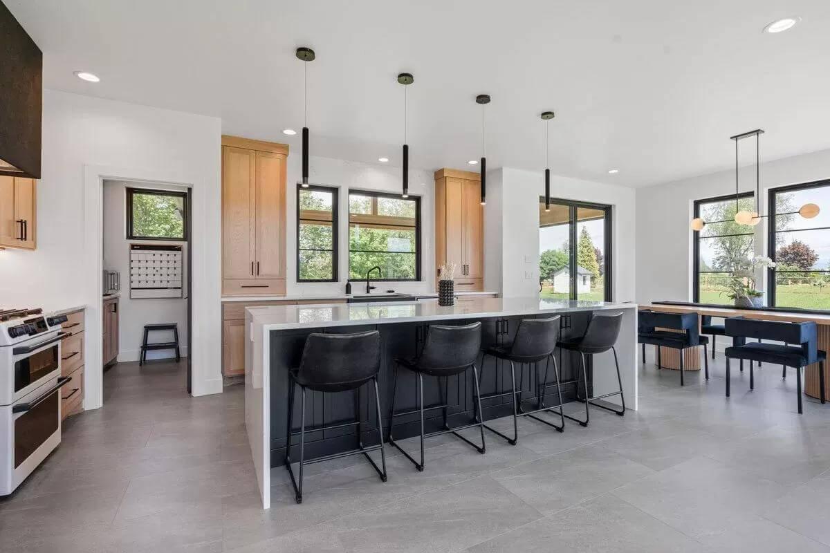 Sleek Kitchen with a Massive Island and Pendant Lighting