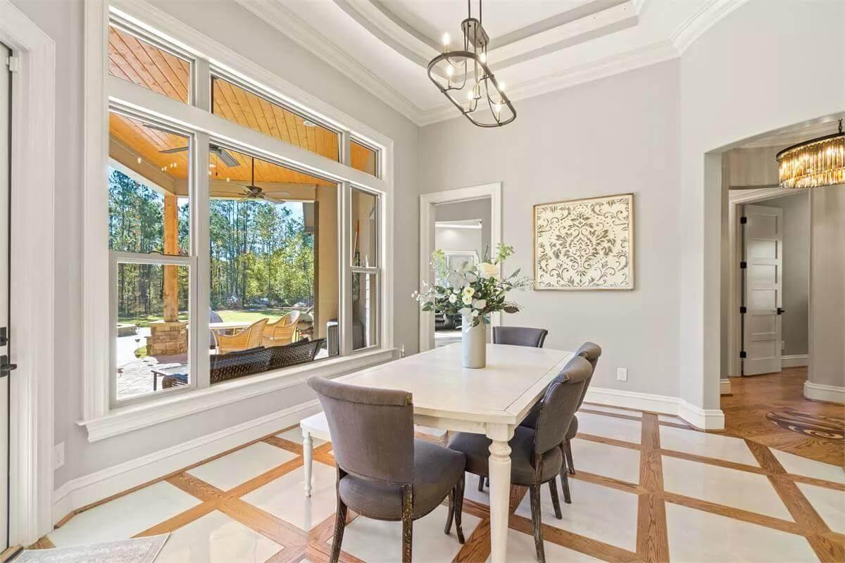 Notice the Geometric Floor Design in This Bright Dining Space