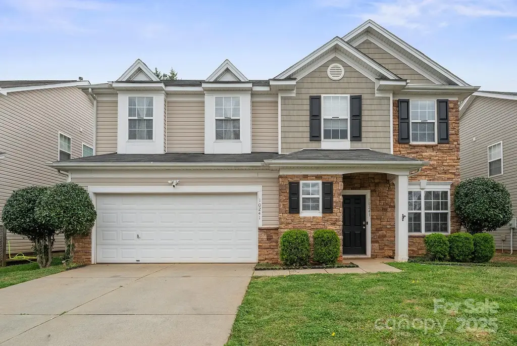 4-Bedroom Traditional Home with Open-Concept Design and 2-Car Attached Garage (2,302 Sq. Ft. Floor Plan)