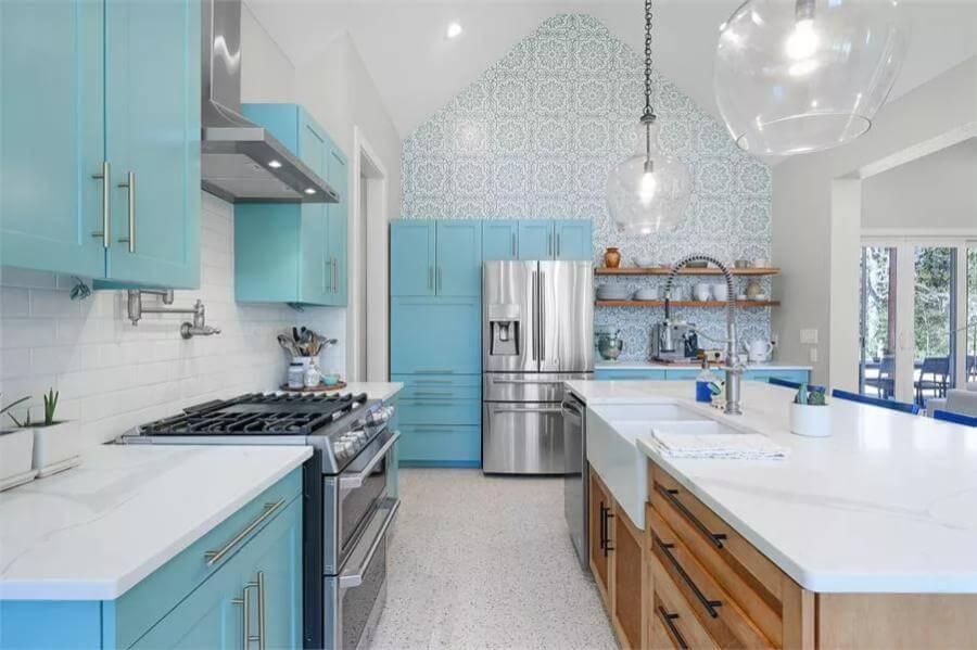 Refreshing Turquoise Cabinets Elevate This Bright Kitchen