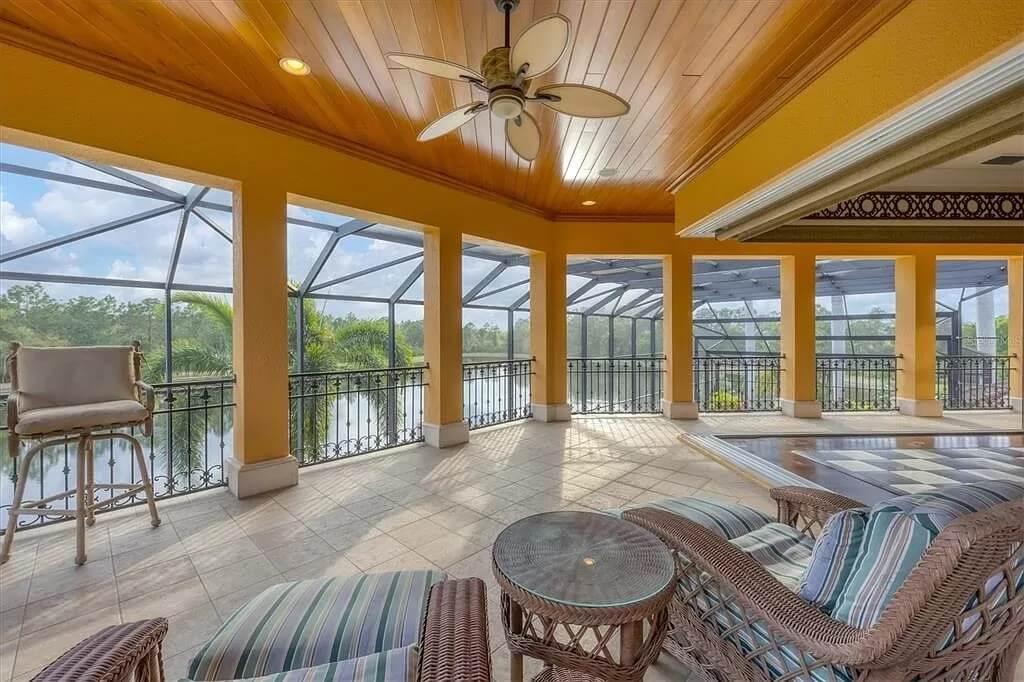 Charming Enclosed Lanai with Striking Wood Ceiling